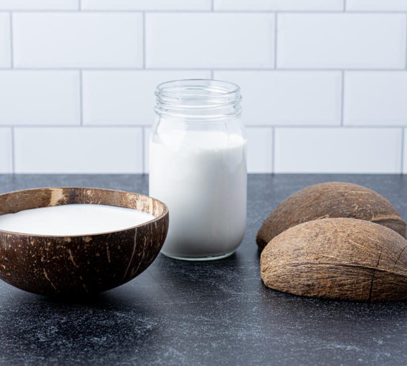 A Jar and Bowl of Fresh Coconut Milk in the USA